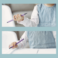 Child holding a pencil with fist